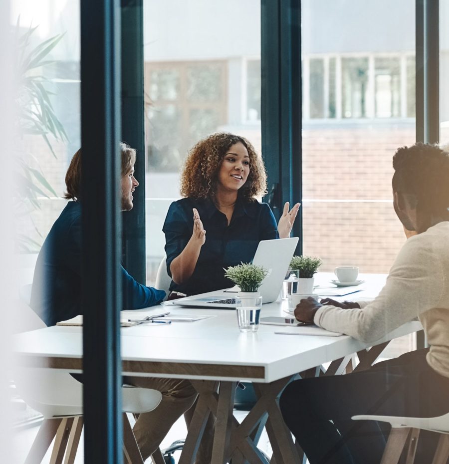 Planning, teamwork and meeting with business people in boardroom for strategy, brainstorming and solution. Corporate, collaboration and conference with employees in office for negotiation development.